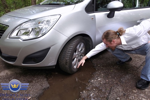 driving-safely-through-roads-with-potholes-deboers-auto.-1