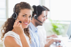 Portrait of confident female call center agent working in office