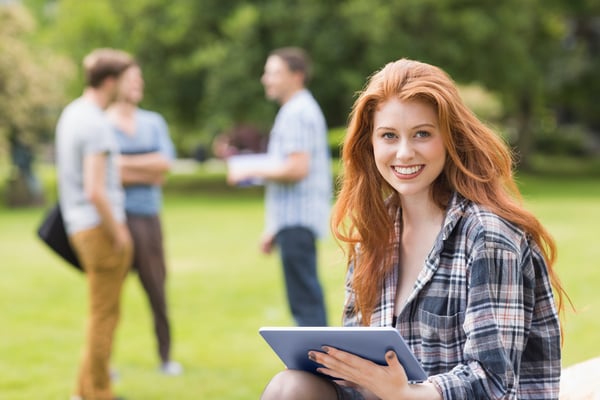 Pretty student studying outside on campus at the university