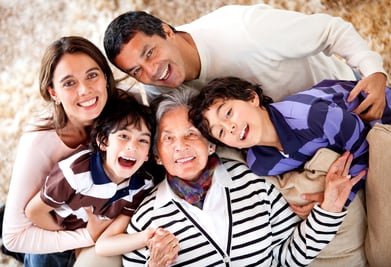 Grandmother and her family looking happy at home