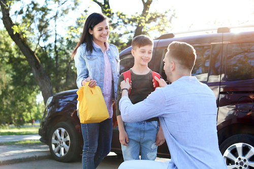 mom and dad sending kid off to school