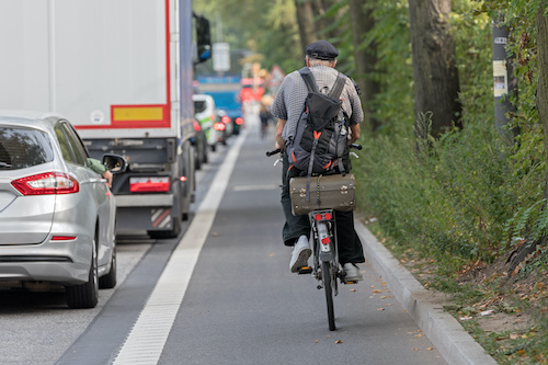 bicylist on road with traffic