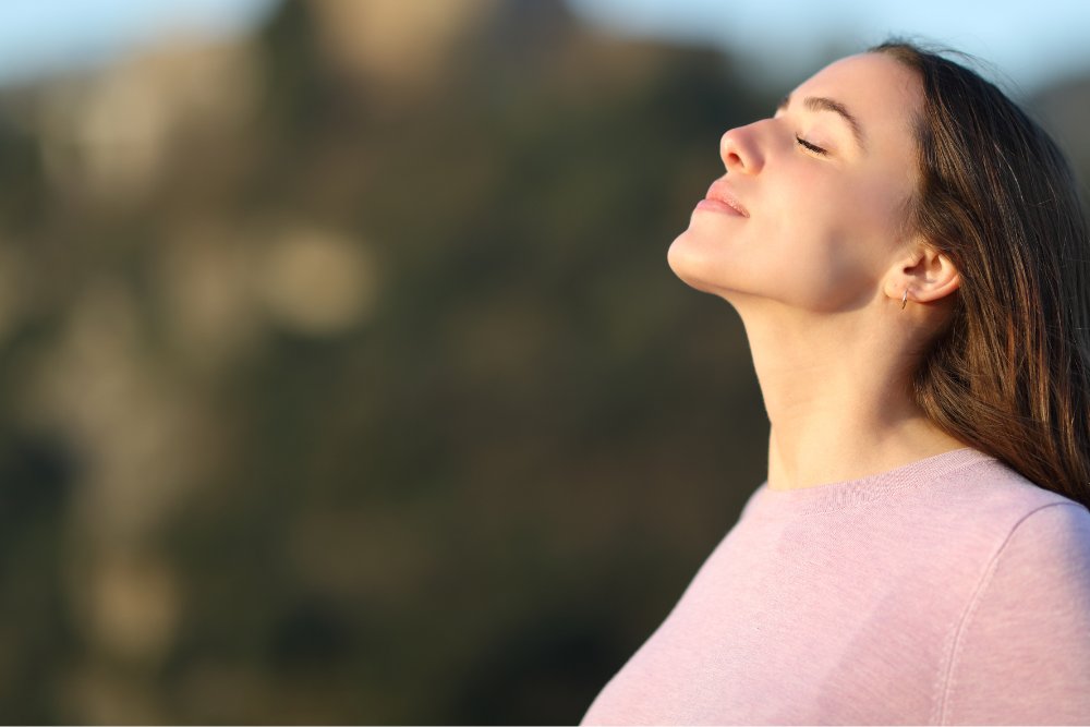 woman taking in a breath of fresh air