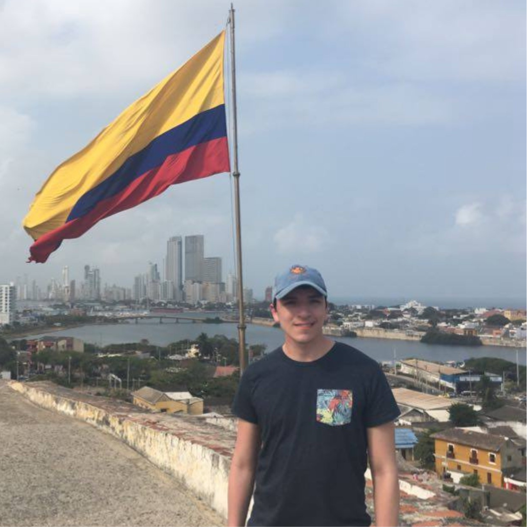 Miguel at bueno vista with flag in background