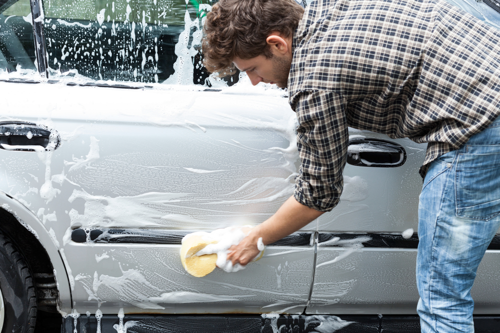 hand washing exterior of car