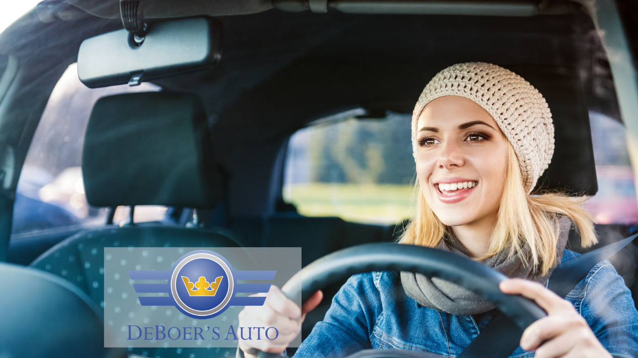 woman in hat driving car